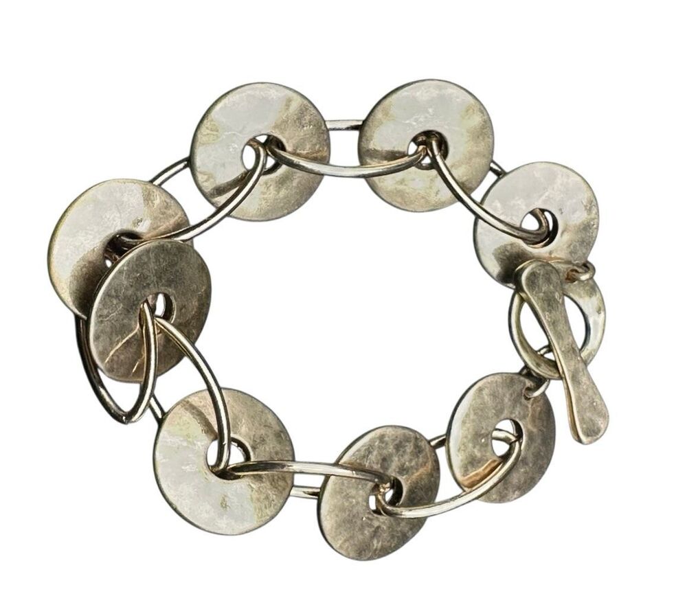 Robert Lee Morris SOHO gold tone disc bracelet with toggle clasp